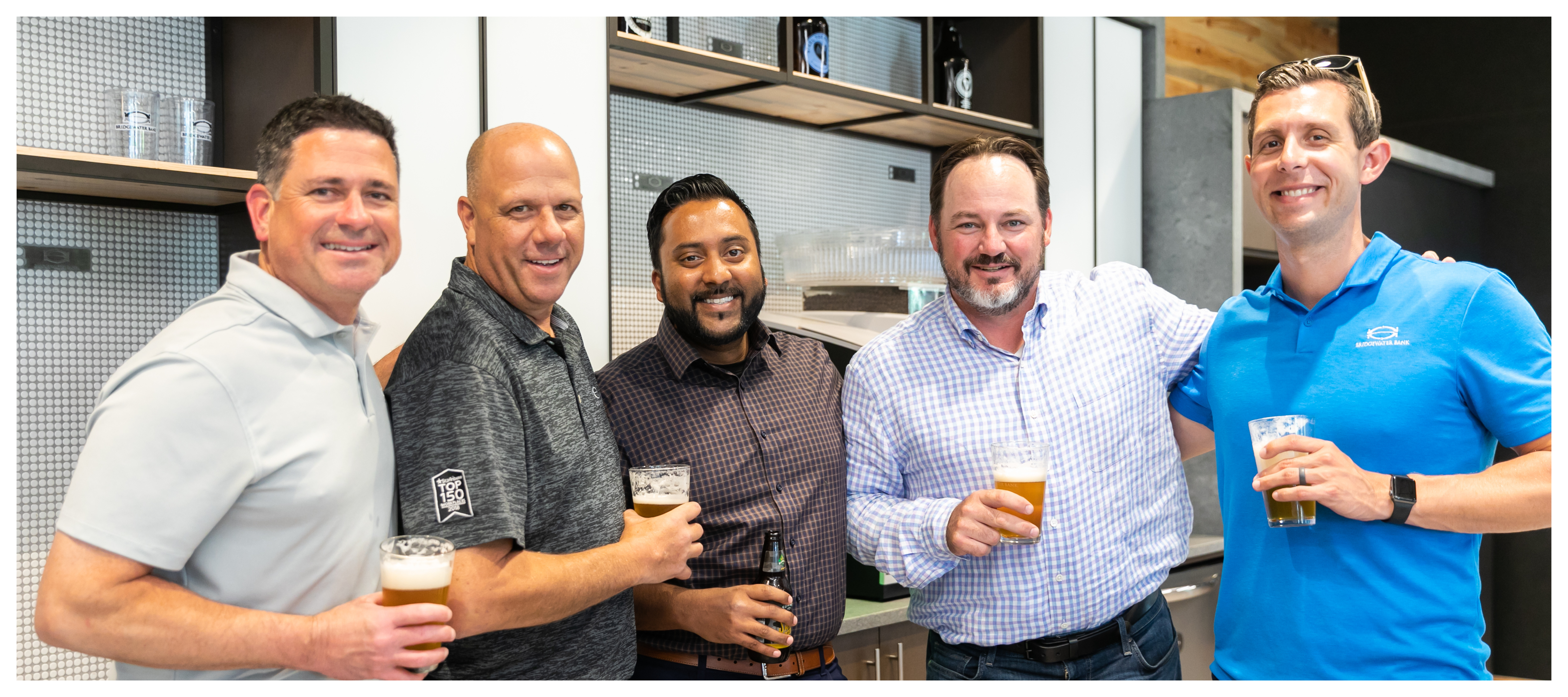 Group photo of PrimeTrust Group team members at an internal happy hour.